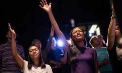 CI-VANTAGE ci-Vantage Worshipers raise their hands to praise Jesus while the Vantage Church band plays Christian rock music during a Sunday service in August. The non-denominational church is part of the Hillsong Family, a network of churches connected to the Australian mega-church that's drawn in celebrities like Justin Bieber.__Uploaded external by: Winter, Jesse