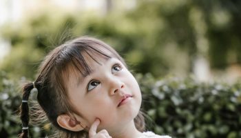 beautiful-kid-playing-thinker-with-serious-royalty-free-image-1669646901
