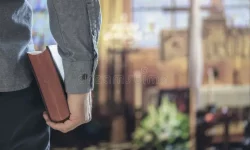 man-holding-holy-bible-church-alter-background-concept-religion-praying-education-study-215319548