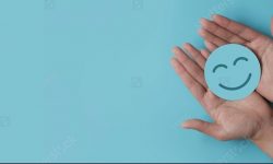 stock-photo-hand-holding-paper-cut-smile-face-positive-thinking-mental-health-assessment-world-mental-1914992353